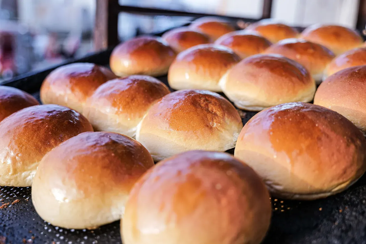 Fresh bread rolls on a tray