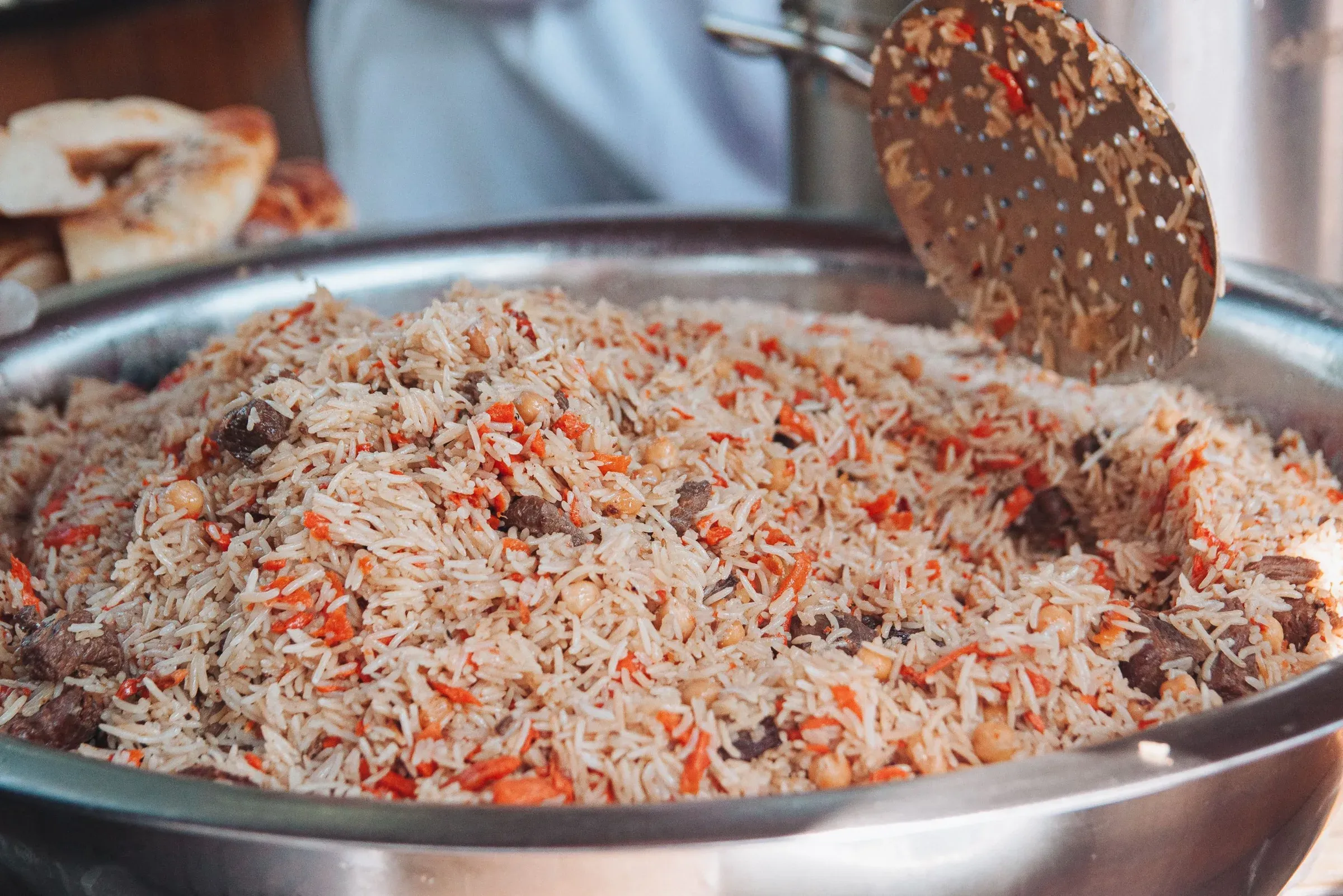 A wide pan of beef pilau, ready to serve